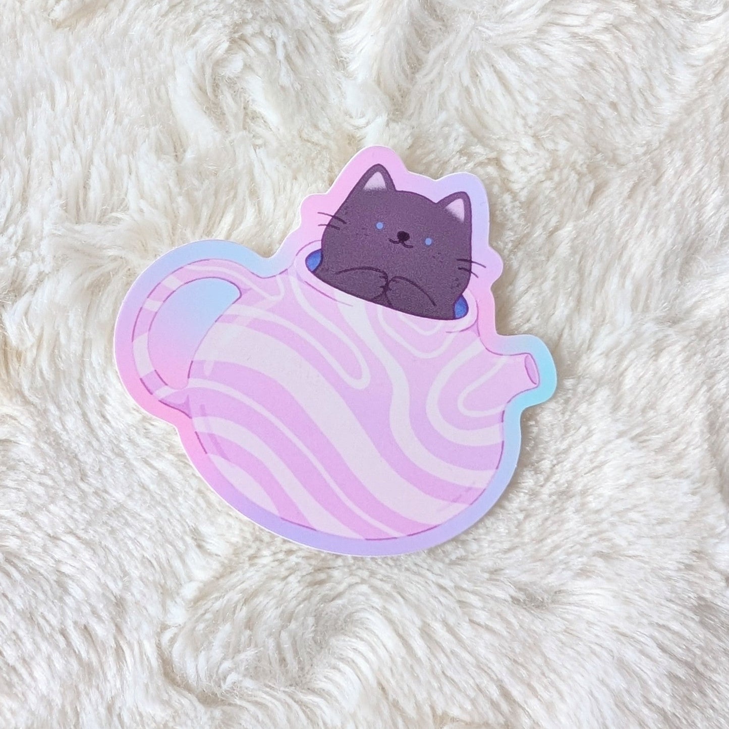 Sticker of a cat with a pastel gradient on a fluffy white surface