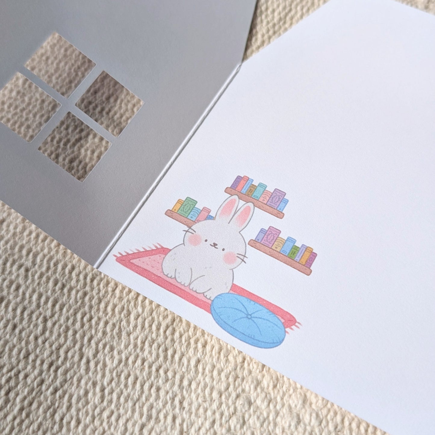 Greeting card with a rabbit design on a textured surface