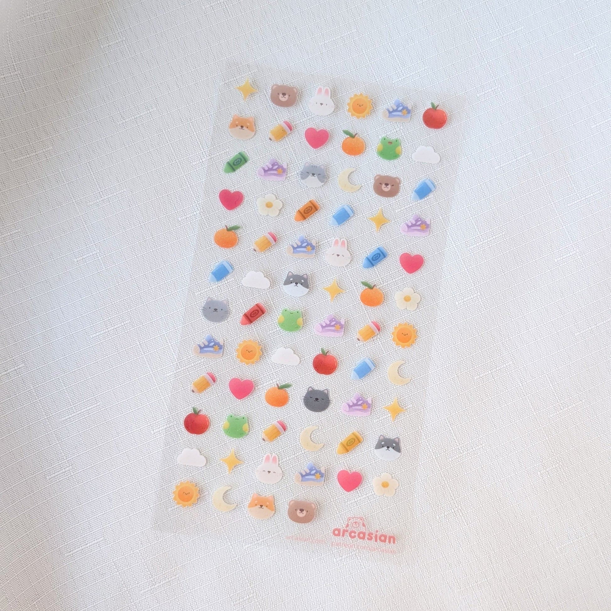 Sticker sheet with various colorful icons on a white background
